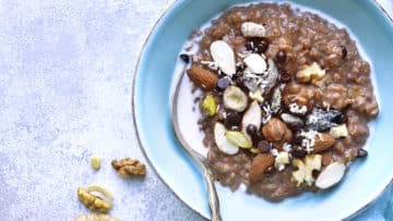 Chocolate oat porridge with nuts.Top view.